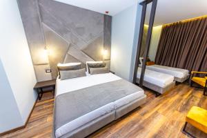 Deluxe Quadruple Room with Balcony - Ground Floor room in Hotel Apollon