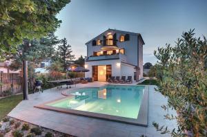 Villa Andrija Family Dream with heated pool at the sea with beautiful garden, outside cinema and kids playground