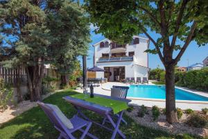 Villa Andrija Family Dream with heated pool at the sea with beautiful garden, outside cinema and kids playground