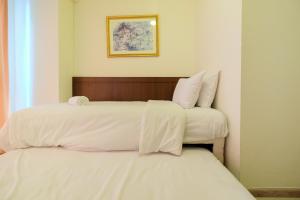 Homey 2BR Apartment at Casa Grande Residence By Travelio