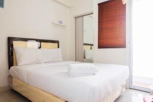 Cozy Studio Apartment Connected to Mall at Green Pramuka City By Travelio