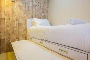 Modern 2BR with City View at Bassura Apartment By Travelio