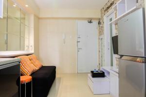 Modern 2BR with City View at Bassura Apartment By Travelio