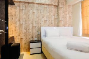 Modern 2BR with City View at Bassura Apartment By Travelio