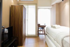 Studio Room Apartment at M-Town Residence near Summarecon Mall Serpong By Travelio