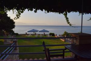 Alexandros Apartments , Beachfront Retreat near Petalidi with Private Sunbeds & Sea View