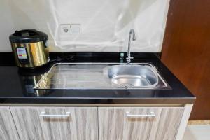 Premium 1BR Apartement At Grand Sungkono Lagoon By Travelio