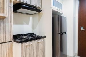 Premium 1BR Apartement At Grand Sungkono Lagoon By Travelio