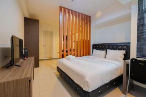 Elegant 1BR at Grand Kamala Lagoon Apartment By Travelio