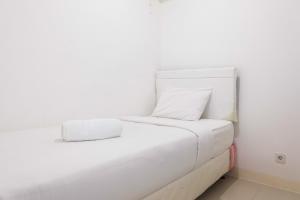 2BR Bassura City Apartment Connect to Swimming Pool By Travelio