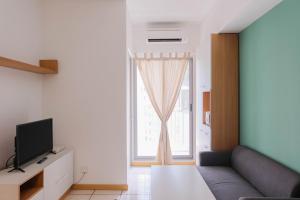 Comfortable 2BR Apartment Serpong M-Town Residence By Travelio
