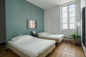 Appartements NOCNOC - Les Trois Graces : photos des chambres