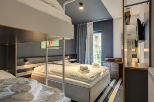 Quadruple Room room in MEININGER Hotel Bruxelles Gare du Midi