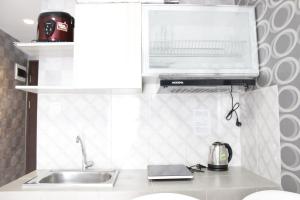 Modern 2BR Apartment at Mekarwangi Square Cibaduyut By Travelio