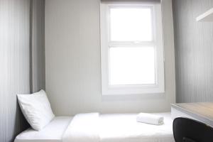 Quiet 2BR Apartment @ Parahyangan Residence Apartement with Mountain View By Travelio