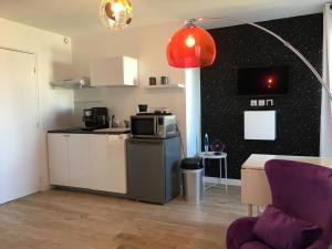 Appartements Le Galaxy centre la Breche wifi calme vue jardin : photos des chambres