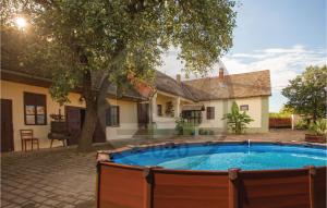 Nice home in Karanac w/ WiFi, Outdoor swimming pool and 4 Bedrooms