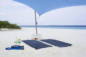 By the shade Maldives