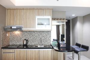 Deluxe Studio Room @ Tamansari La Grande Apartment By Travelio