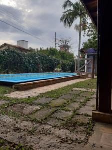 Casa Rústica praia da Ferrugem próximo praia com piscina compartilhada