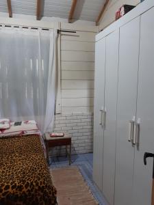 Casa Rústica praia da Ferrugem próximo praia com piscina compartilhada