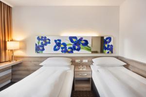 Twin Room room in H+ Hotel Frankfurt Airport West