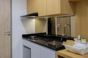 Minimalist 1BR at Akasa Pure Living Apartment By Travelio