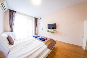 One-Bedroom Apartment with Balcony and Side Sea View (2 Adults +2 Children) room in Prestige Sands Resort