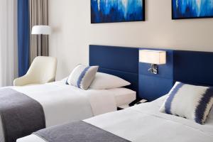 Executive Twin Room - Complimentary Lounge Access room in Mövenpick Hotel & Apartments Dubai