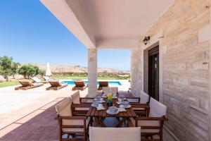 Dimokritos Villas IV, V, & VI, a homestay experience, By ThinkVilla