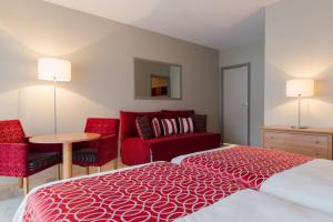 Hotels The Originals Boutique, Hotel Les Strelitzias : photos des chambres