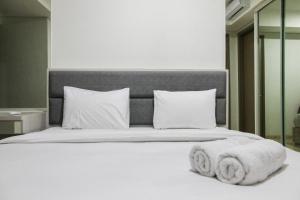 Sea View 1BR at Gold Coast Apartment near PIK By Travelio