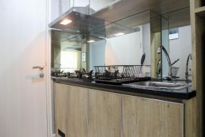 Homey Studio Apartment at Springlake Summarecon Bekasi By Travelio
