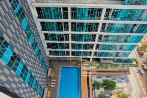 Modern and Cozy 1BR Brooklyn Alam Sutera Apartment By Travelio