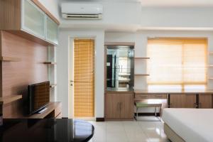 Simply Furnished Studio Apartment at Scientia Residence By Travelio