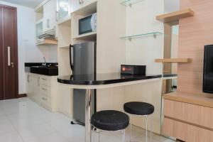 Simply Furnished Studio Apartment at Scientia Residence By Travelio