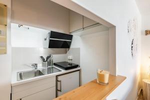 Appartements Studio centre ville avec parking : photos des chambres