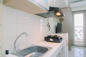 Modern Furnished Studio at Springlake Summarecon Bekasi Apartment By Travelio