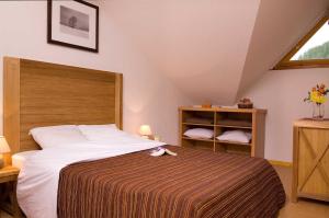 Appart'hotels Madame Vacances Residence Le Parc Des Airelles : photos des chambres