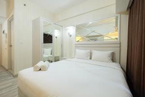 Elegant Studio at Springlake Summarecon Bekasi Apartment By Travelio