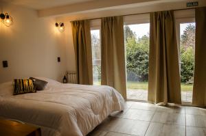 Aiksh Estudio H-3 Pax, parrilla y estacionamiento