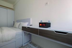 Affordable Price Studio at Riverview Jababeka Apartment Cikarang By Travelio