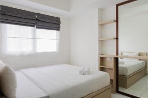Elegant 1BR Apartment at Casa De Parco near AEON Mall By Travelio