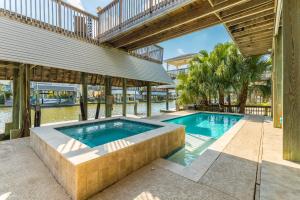Four-Bedroom House room in New Listing! Gorgeous Canal Home With Dock & Pool Home