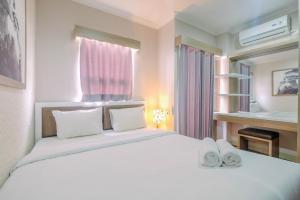 1BR Apartment Atlanta Residences next to RS Bunda Margonda By Travelio