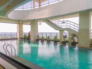 1BR Apartment Atlanta Residences next to RS Bunda Margonda By Travelio