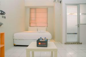 Homey Minimalist Studio Apartment at Menteng Square By Travelio