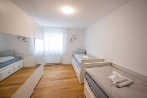 Agrimonia - 5,5-Zi Duplex Wohnung bis 9 Personen mit eigenem Garten