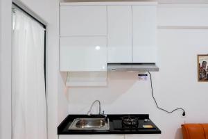 Pleasant 2BR Apartment at Bassura City near Shopping Mall By Travelio