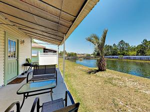 Three-Bedroom Apartment room in Updated Getaway With Pool & Patio Overlooking Pond Condo
